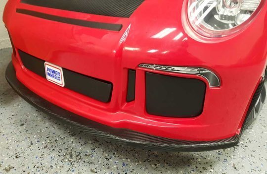 Custom Graphic Wrap Design on a Red Porsche Power Wheels by Premier Auto Tint - Front View